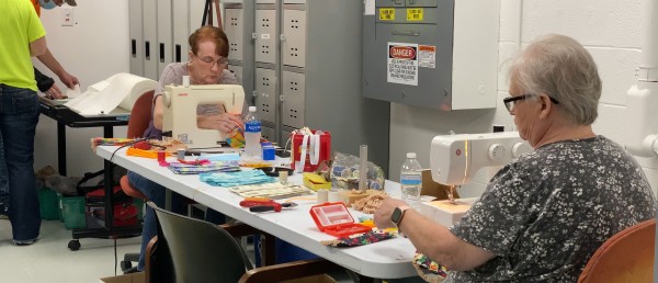 Grote Employees make masks for each other during covid-19