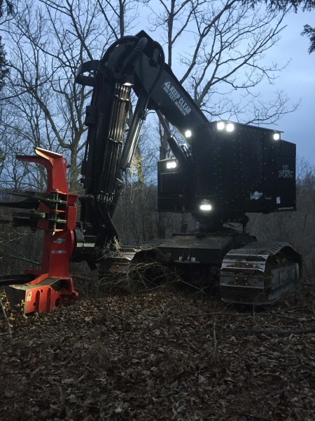 tree logger working at night with grote led lights