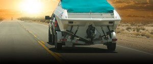 truck pulling a boat on a trailer